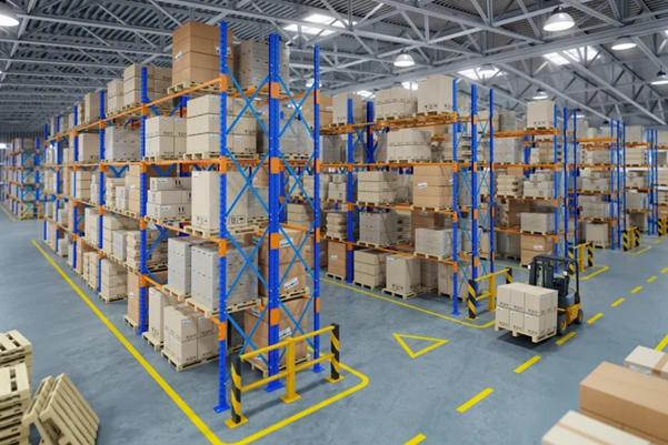 Warehouse interior showing storage racking and a forklift operating Warehouse interior showing storage racking and a forklift operating