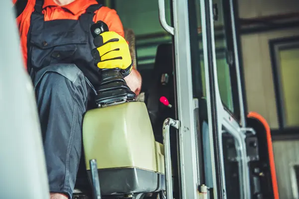 A skilled operator demonstrating the controls of a forklift A skilled operator demonstrating the controls of a forklift