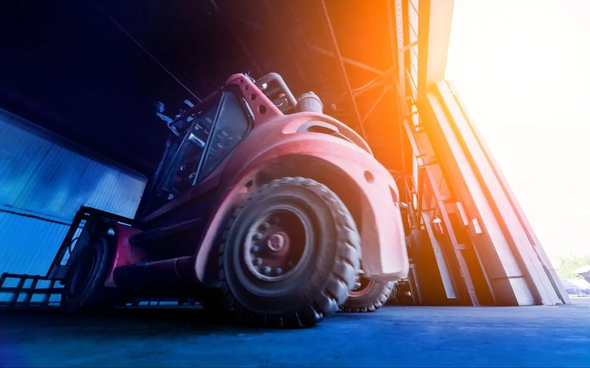 Industrial Forklift Entering Warehouse Daily Inspection Large industrial forklift entering a warehouse