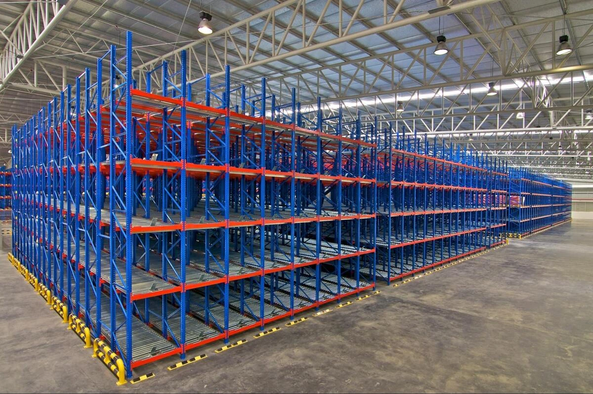 An empty industrial storage racking system in a spacious warehouse